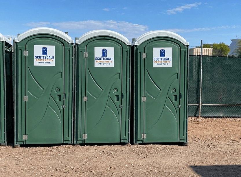 Clean porta potty rental units lined up in the service yard