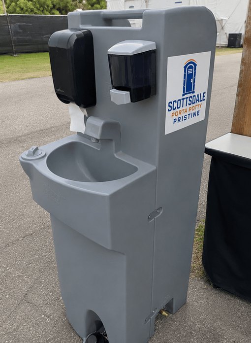 Two-basin portable sink rental set up beside an event tent